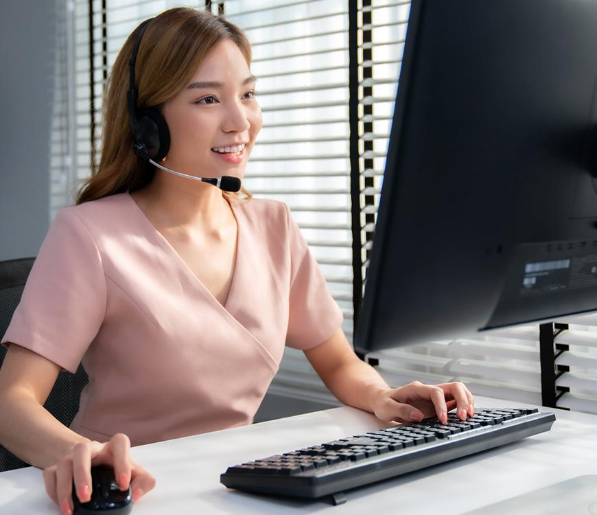 Brookfield employee using a headset with a VOIP phone